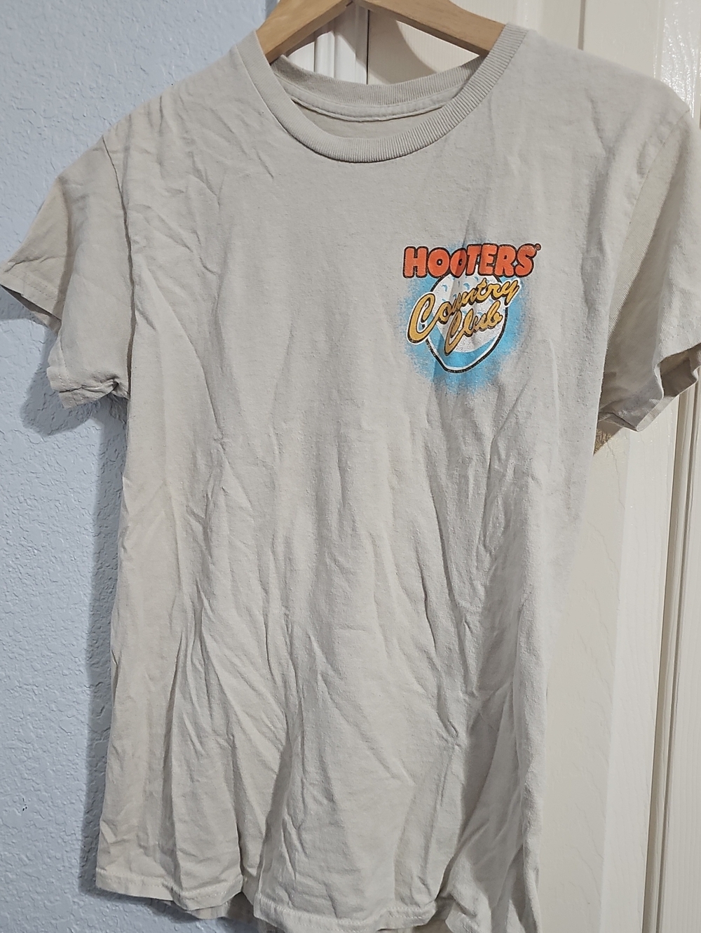 Hooters Light Cream Short Sleeve Logo Tee with Orange and Blue Accent